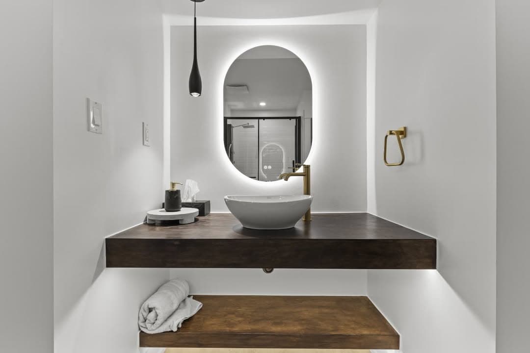 Backlit vanity mirror with pendant